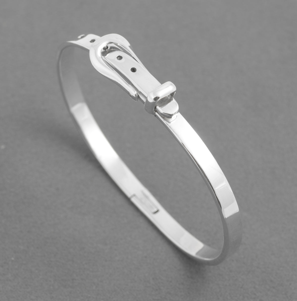 Mexican sterling silver belt bangle standing upright to show its buckle