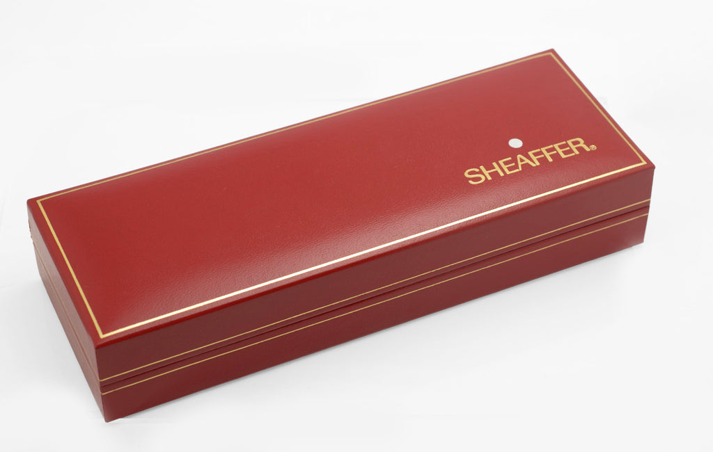 Closed red Sheaffer presentation case with gold lettering