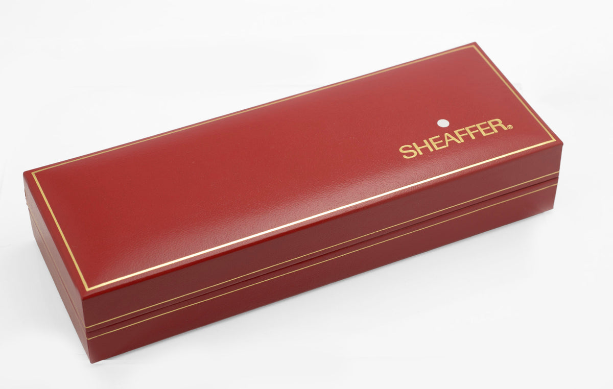 Closed red Sheaffer presentation case with gold lettering